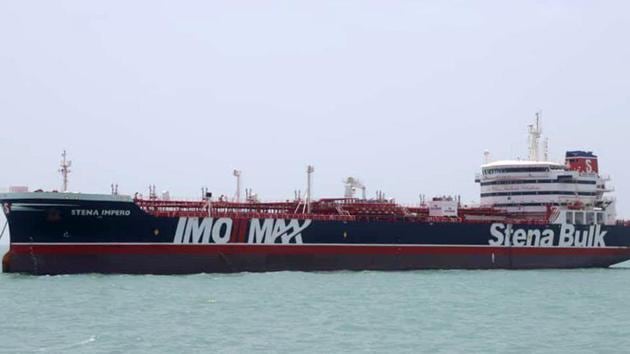 This handout picture released by Tasnim News Agency on July 20, 2019, shows British-flagged tanker Stena Impero anchored in Bandar Abbas in southern Iran. - A British-flagged tanker seized by Iran is now at anchor off the port of Bandar Abbas with all its crew aboard after colliding with a fishing boat, authorities said on July 20. The Swedish-owned Stena Impero "collided with a fishing boat", said Allah-Morad Afifipoor, director-general of the Hormozgan province port and maritime organisation.(AFP)