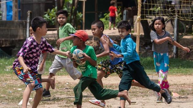 Youth worker-turned-coach Aung Kyaw Lin, 24, helped set up the team four years ago to run alongside English and math lessons, and workshops on fire safety and health.”Children here used to spend their free time in gaming shops,” he says. “When they started playing rugby, they stopped arguing and worked together.” (Sai Aung Main / AFP) Youth worker-turned-coach Aung Kyaw Lin, 24, helped set up the team four years ago to run alongside English and math lessons, and workshops on fire safety and health.”Children here used to spend their free time in gaming shops,” he says. “When they started playing rugby, they stopped arguing and worked together.” (Sai Aung Main / AFP)