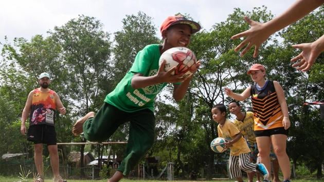 Players from the Little Dragons rugby team take part in a training session in the North Dagon township, located on the outskirts of Yangon. Sidestepping cowpats and garbage, Myanmar’s only home-grown junior rugby side train on the outskirts of Yangon, preparing to take on children from the city’s well-heeled international schools. (Sai Aung Main / AFP) Players from the Little Dragons rugby team take part in a training session in the North Dagon township, located on the outskirts of Yangon. Sidestepping cowpats and garbage, Myanmar’s only home-grown junior rugby side train on the outskirts of Yangon, preparing to take on children from the city’s well-heeled international schools. (Sai Aung Main / AFP)