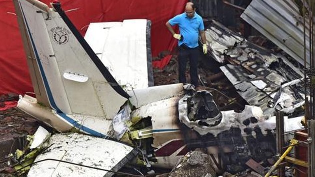 An official examines the site where a chartered plane crashed in Mumbai’s Ghatkopar on June 28, 2018.(Vijayanand Gupta/HT File Photo)