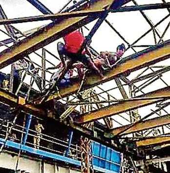 A mentally-challenged man climbed onto a partially dismantled foot overbridge (FoB) at Malad railway station.(HT Photo)