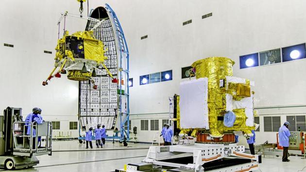 ISRO officials carry out the hoisting of the Vikram Lander during the integration of Chandrayaan-2. The mission will send the rover to the moon’s south pole and Indian scientists hope to directly observe the water ice on the lunar surface, evidence for which was gathered by spectrometers aboard India’s first moon mission in 2008. (ISRO / PTI) 