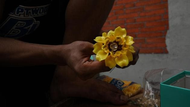 “I am so grateful because I never imagined I could still pursue my studies,” said 21-year-old Nathan Andres, who was detained as a juvenile for rape but has been allowed to serve out his sentence in the Bulacan youth facility. However Andres, who wants to become a teacher, says targeting 12-year-olds is not the answer. “We are like the flowers we craft from old papers. People think we are garbage, useless. But actually we still have value.” (Ted Aljibe / AFP) “I am so grateful because I never imagined I could still pursue my studies,” said 21-year-old Nathan Andres, who was detained as a juvenile for rape but has been allowed to serve out his sentence in the Bulacan youth facility. However Andres, who wants to become a teacher, says targeting 12-year-olds is not the answer. “We are like the flowers we craft from old papers. People think we are garbage, useless. But actually we still have value.” (Ted Aljibe / AFP)