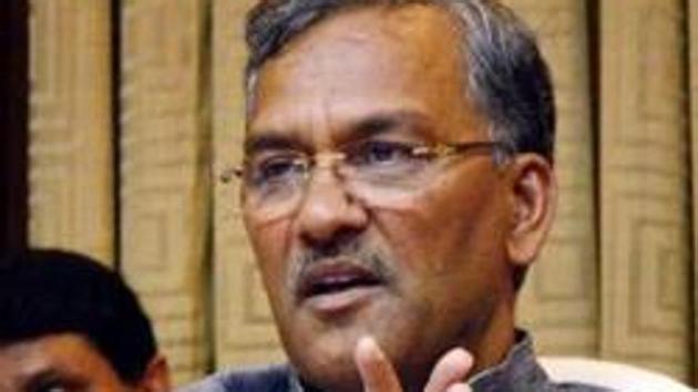Issuing a stern warning to lazy officials, the Uttarakhand chief minister Trivendra Singh Rawat asked them to mend their ways or face the music.(PTI Photo)