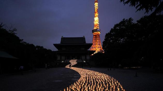 Thousands of candles are arranged in the shape of the Milky Way to celebrate Tanabata, a Japanese star festival, at Zojoji Temple. The Olympics will be simply a sideshow for some Tokyo visitors, astounded by the cleanliness, courtesy and order. Japan’s sprawling capital is a dense mix of the traditional and eccentric where bowing meets bustle. (Jae C. Hong / AP)