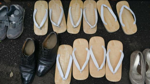 Traditional Japanese footwear called zori are seen next to sneakers and dress shoes during a kendo competition at the Hie Shrine. (Jae C. Hong / AP)