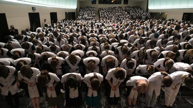 The Summer Olympics will return to Tokyo next year for the first time since 1964. The world’s best athletes will be on display, of course, but so will Japan’s sprawling capital - a dense mix of the traditional and the eccentric. Wearing school uniforms, students at Yamano Beauty College bow to a speaker during a ceremony held to celebrate the school’s 83rd year anniversary in Tokyo. (Jae C. Hong / AP)