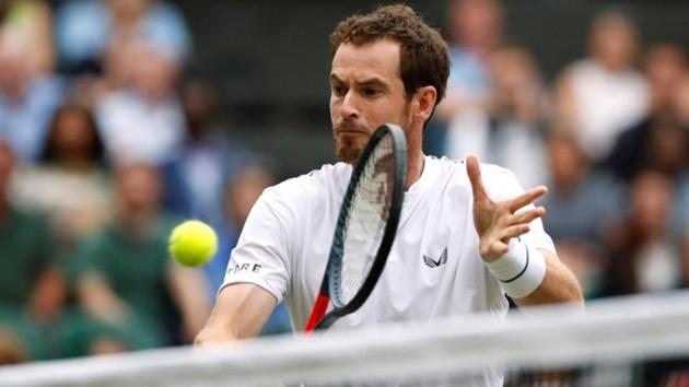 Andy Murray in action during his second round mixed doubles match.(REUTERS)