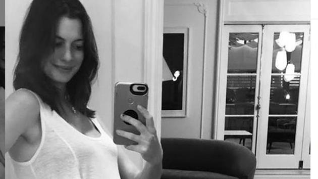 Anne Hathaway announces her second pregnancy in a white gown.(Instagram)
