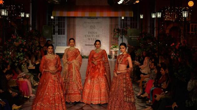 The models look stunning in Rahul Mishra’s creations.(AFP)