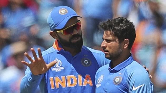 Virat Kohli congratulates India's Kuldeep Yadav, right, for dismissing Sri Lanka's Lahiru Thirimanne.(AP)