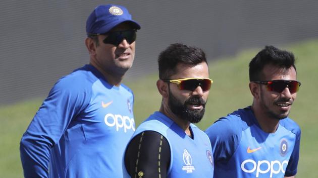File image of India's captain Virat Kohli, center, and teammates MS Dhoni, left, and Yuzvendra Chahal attend a training session.(AP)