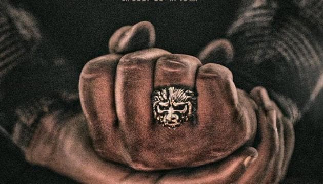 KGF Chapter 2 poster shows a dramatic ring with the face of a lion.