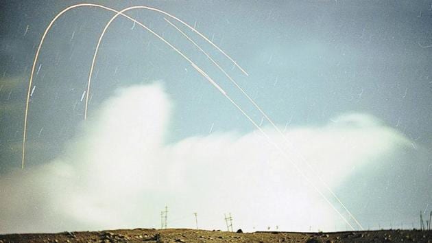 A long exposure shows trails of shells fired in Kargil in July 1999. As the Indian army moved ahead, Nawaz Sharif announced the withdrawal of troops in early July following his meeting with Bill Clinton. With Tiger Hill and Drass retaken in the first week of July, Pakistani forces began pulling out, with Prime Minister Atal Bihari Vaypayee declaring Operation Vijay a success on July 14, 1999. (Manish Swarup / HT Archive) 