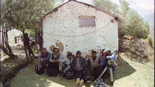 Indian Photo Journalists rest while covering the operations against Pakistan in Kargil, July 01, 1999. The war is considered a rare example of high altitude warfare between two nuclear states. The difficult terrain of the region limited the extent of engagement with heavy artillery shelling the attack of choice and risks to providing land support with arterial highways such as the NH 1D (Srinagar to Leh) under Pakistani fire. (Manish Swarup / HT Archive) 