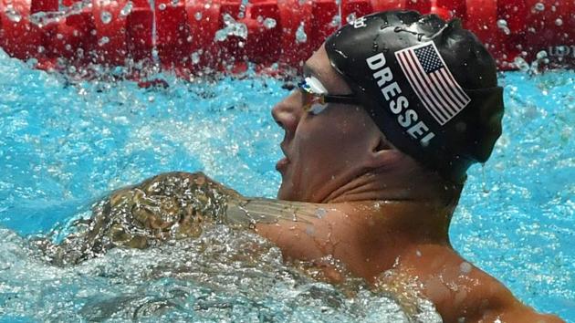 USA's Caeleb Dressel celebrates winning the final of the men's 100m freestyle event.(AFP) USA's Caeleb Dressel celebrates winning the final of the men's 100m freestyle event.(AFP)