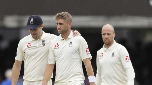 England's Chris Woakes leaves the pitch with team mates. (AP) England's Chris Woakes leaves the pitch with team mates. (AP)