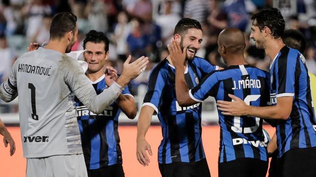 Inter Milan's players celebrate winning the match against Paris St. Germain.(AFP)