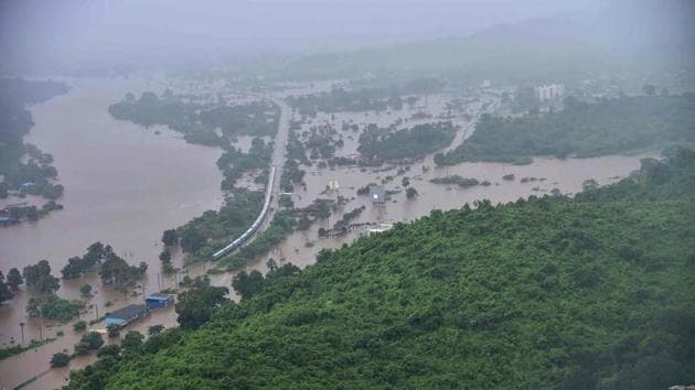 Mahalaxmi Express stranded in a flooded area in-between Badlapur and Vangani following heavy monsoon rains, some 70 kms from Mumbai. Indian navy helicopters and emergency service boats came to the rescue of about 700 people stuck on a train caught in floods near Mumbai. The Mahalaxmi Express left Mumbai late Friday for Kolhapur but got only 60 kilometres before it became stranded as torrential rain flooded the tracks. (INDIAN NAVY / AFP) Mahalaxmi Express stranded in a flooded area in-between Badlapur and Vangani following heavy monsoon rains, some 70 kms from Mumbai. Indian navy helicopters and emergency service boats came to the rescue of about 700 people stuck on a train caught in floods near Mumbai. The Mahalaxmi Express left Mumbai late Friday for Kolhapur but got only 60 kilometres before it became stranded as torrential rain flooded the tracks. (INDIAN NAVY / AFP)