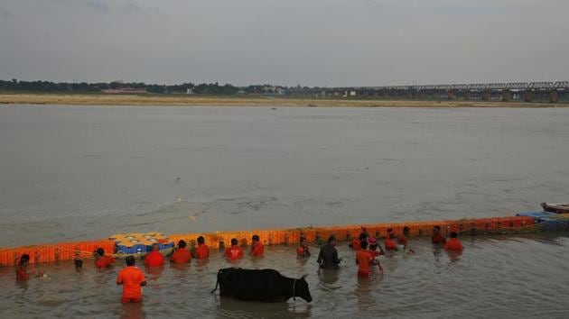 Hindu pilgrims, known as Kanwarias, take holy dips in the Ganges River in Prayagraj, Uttar Pradesh. Kanwarias are devotees performing a ritual pilgrimage in which they walk the roads of India, clad in saffron, and carrying ornately decorated canisters of sacred water from the Ganges River over their shoulders to take it back to Hindu temples in their hometowns, during the Hindu lunar month of Shravana. (Rajesh Kumar Singh / AP) Hindu pilgrims, known as Kanwarias, take holy dips in the Ganges River in Prayagraj, Uttar Pradesh. Kanwarias are devotees performing a ritual pilgrimage in which they walk the roads of India, clad in saffron, and carrying ornately decorated canisters of sacred water from the Ganges River over their shoulders to take it back to Hindu temples in their hometowns, during the Hindu lunar month of Shravana. (Rajesh Kumar Singh / AP)