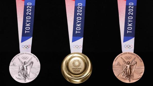 Medals for the Tokyo 2020 Olympic Games unveiled in Tokyo. A collection of nearly 80,000 tons of mobile phones and small electronic devices around Japan are used in the crafting every gold, silver and bronze Olympic and Paralympic medal. (Tokyo 2020 / AFP) Medals for the Tokyo 2020 Olympic Games unveiled in Tokyo. A collection of nearly 80,000 tons of mobile phones and small electronic devices around Japan are used in the crafting every gold, silver and bronze Olympic and Paralympic medal. (Tokyo 2020 / AFP)