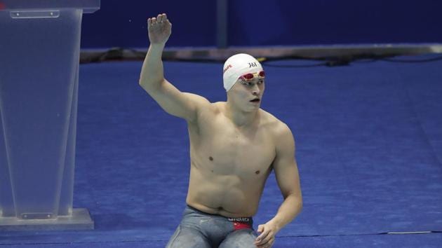 China's Sun Yang waves as he leave the pool following the men's 4x200m freestyle relay final at the World Swimming Championships in Gwangju, South Korea, Friday, July 26, 2019.(AP)