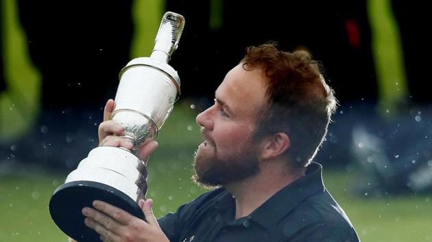 Republic of Ireland's Shane Lowry celebrates with the Claret Jug trophy after winning The Open Championship. (Jason Cairnduff / REUTERS) Republic of Ireland's Shane Lowry celebrates with the Claret Jug trophy after winning The Open Championship. (Jason Cairnduff / REUTERS)