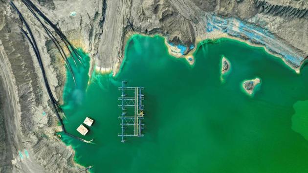 Aerial view of a tailings dam -enbankment used to store byproducts of mining operations, in this case of the extraction of copper- of the Minera Valle Central mining company, in Rancagua, Chile. - The other side of the coin of the mining industry in Chile is the existance of hundreds of tailings dams -enbankments of byproducts of the extraction of copper, the country's main export product- which mark the territory like silent witnesses of man's action on nature. (Martin Bernetti / AFP) Aerial view of a tailings dam -enbankment used to store byproducts of mining operations, in this case of the extraction of copper- of the Minera Valle Central mining company, in Rancagua, Chile. - The other side of the coin of the mining industry in Chile is the existance of hundreds of tailings dams -enbankments of byproducts of the extraction of copper, the country's main export product- which mark the territory like silent witnesses of man's action on nature. (Martin Bernetti / AFP)