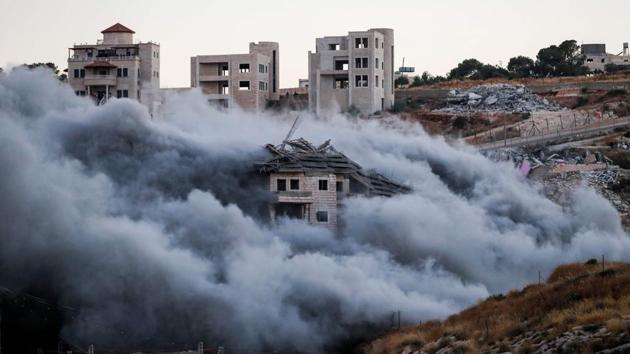 Demolition of a Palestinian building which was under construction, in the the Palestinian village of Sur Baher in East Jerusalem. Israel demolished a number of Palestinian homes it considers illegally constructed near its separation barrier south of Jerusalem on July 22, in a move that drew international condemnation. (Ahmad Gharabli / AFP) Demolition of a Palestinian building which was under construction, in the the Palestinian village of Sur Baher in East Jerusalem. Israel demolished a number of Palestinian homes it considers illegally constructed near its separation barrier south of Jerusalem on July 22, in a move that drew international condemnation. (Ahmad Gharabli / AFP)