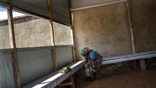 A woman waits at the morgue for the body of her relative to be cleared for burial. During the 2014-16 Ebola epidemic in West Africa, which left more than 11,300 people dead, health workers could only dream of a vaccine with a 97.5 percent effectiveness rate that could improve the odds of survival even in those already infected. (Jerome Delay / AP) A woman waits at the morgue for the body of her relative to be cleared for burial. During the 2014-16 Ebola epidemic in West Africa, which left more than 11,300 people dead, health workers could only dream of a vaccine with a 97.5 percent effectiveness rate that could improve the odds of survival even in those already infected. (Jerome Delay / AP)