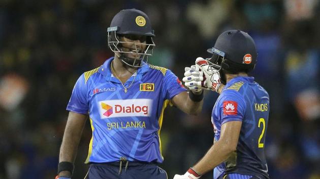 Sri Lanka's Kusal Mendis, right, and Angelo Mathews celebrate their victory.(AP)