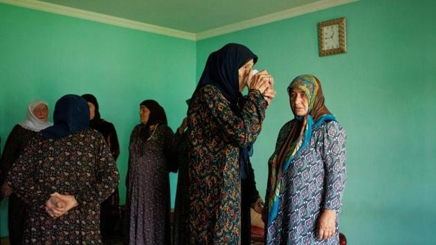 Women are having a break after singing and dancing on a very hot day for a traditional Sufi ceremony, zikr, performed every Friday in Duisi village of Pankisi. (Ekaterina Anchevskaya / REUTERS)