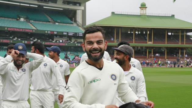 Virat Kohli and the Indian cricket team celebrate winning the series and the Border–Gavaskar Trophy during day five of the Fourth Test match in the series between Australia and India at Sydney Cricket Ground .(Getty Images)