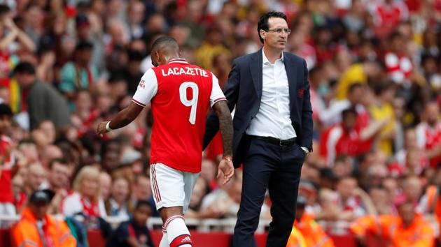 Arsenal manager Unai Emery with Alexandre Lacazette.(Reuters)