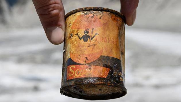 A man holds an old can of orange juice found on the glacier after the melting of ice. The alps are also frequented by an avalanche of loose rocks, called rockfall. These rockfalls scar the mountainside and damage routes used by climbers visiting Mont Blanc, Europe’s tallest peak. (Marco Bertorello / AFP) A man holds an old can of orange juice found on the glacier after the melting of ice. The alps are also frequented by an avalanche of loose rocks, called rockfall. These rockfalls scar the mountainside and damage routes used by climbers visiting Mont Blanc, Europe’s tallest peak. (Marco Bertorello / AFP)