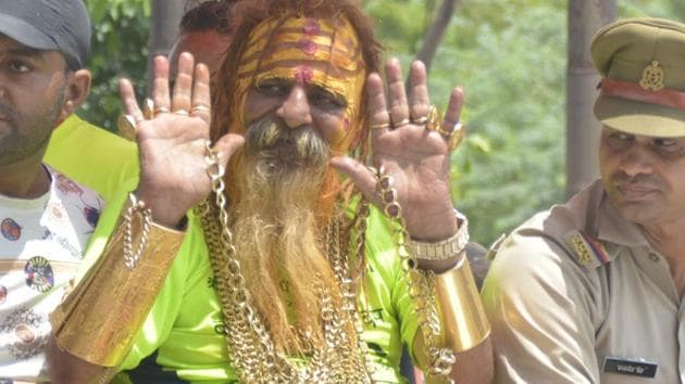 Sudhir Makka, also known as Golden Baba for his penchant for gold jewellery, had donned 14 kg gold this year during the Kanwar yatra.(Sakib Ali / HT Photo) Sudhir Makka, also known as Golden Baba for his penchant for gold jewellery, had donned 14 kg gold this year during the Kanwar yatra.(Sakib Ali / HT Photo)