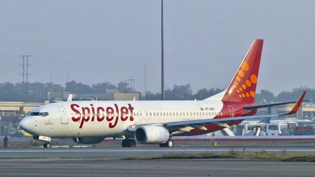 Two pilots of the SpiceJet flight to Mumbai that overshot the runway with 160 passengers and was stuck in the ground for four days have been banned from flying for the next one year.(AP Photo) Two pilots of the SpiceJet flight to Mumbai that overshot the runway with 160 passengers and was stuck in the ground for four days have been banned from flying for the next one year.(AP Photo)