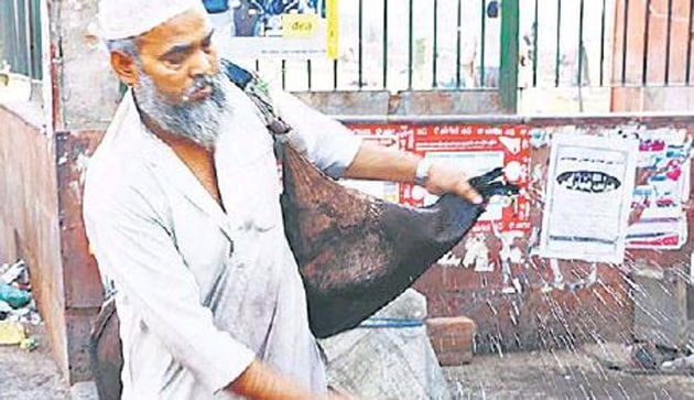 Jameel, a resident of Walled City, is a water-seller who still uses the ‘mashak’ or a goat-skin bag to store water. He says that the profession has been passed down to him through a long chain of these forefathers.(HT Photo)