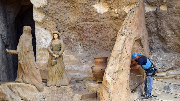 Mario, who hails from Poland, had arrived in Egypt on an educational mission, and was then looking for an opportunity to serve God at the monastery. “I want you to turn the mountain into an open Bible,” Mario recalls the priest telling him. Back then, Mario had no experience in sculpting. But he bought an electric drill and chisel hammer and within days had finished his first sculpture. (Mohamed el-Shahed / AFP) Mario, who hails from Poland, had arrived in Egypt on an educational mission, and was then looking for an opportunity to serve God at the monastery. “I want you to turn the mountain into an open Bible,” Mario recalls the priest telling him. Back then, Mario had no experience in sculpting. But he bought an electric drill and chisel hammer and within days had finished his first sculpture. (Mohamed el-Shahed / AFP)