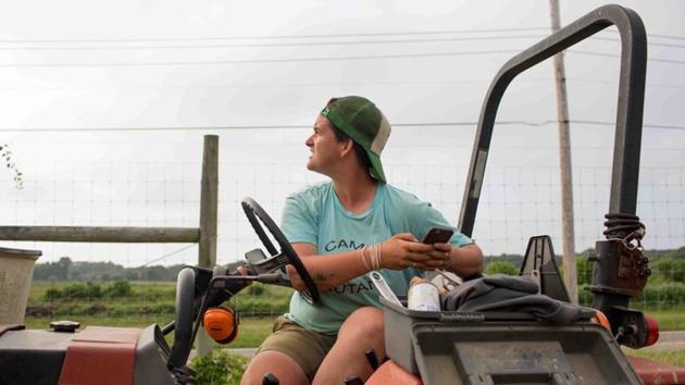 Layton Guenther, director of Quail Hill Farm, checks the sky for coming rain in Amagansett. “Farming - for where I grew up - was a very unusual career choice,” said Guenther, 32, who grew up in a New York City suburb and identifies as gender non-binary and uses they/them pronouns. But “everybody belongs on the land in their own way. None of us should feel alienated from it.” (Lindsay Morris / REUTERS) Layton Guenther, director of Quail Hill Farm, checks the sky for coming rain in Amagansett. “Farming - for where I grew up - was a very unusual career choice,” said Guenther, 32, who grew up in a New York City suburb and identifies as gender non-binary and uses they/them pronouns. But “everybody belongs on the land in their own way. None of us should feel alienated from it.” (Lindsay Morris / REUTERS)