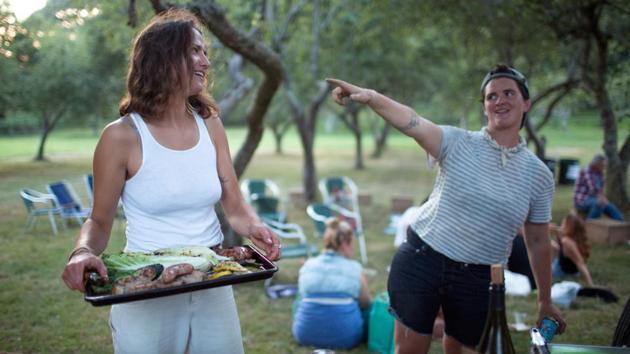 Layton Guenther (R) gathers with other farmers for a potluck dinner and music in Amagansett. New York has over 1,000 certified organic farms, ranking it third in the country, behind California and Wisconsin, the USDA data shows. These farms account for nearly 4% of the state’s overall farm acreage, compared with a national average of roughly 0.6%. (Lindsay Morris / REUTERS) Layton Guenther (R) gathers with other farmers for a potluck dinner and music in Amagansett. New York has over 1,000 certified organic farms, ranking it third in the country, behind California and Wisconsin, the USDA data shows. These farms account for nearly 4% of the state’s overall farm acreage, compared with a national average of roughly 0.6%. (Lindsay Morris / REUTERS)