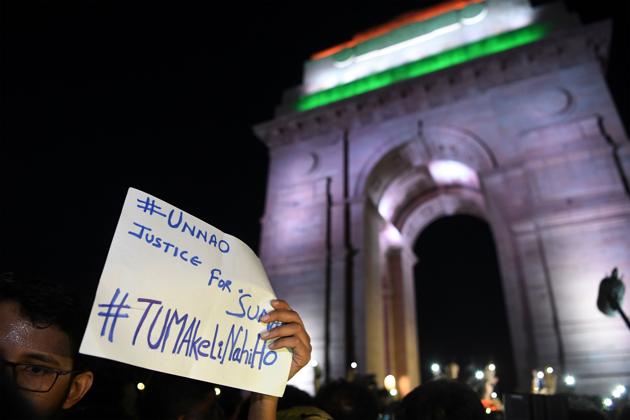 People take part in a rally for the Unnao rape victim, New Delhi, July 29(AFP)