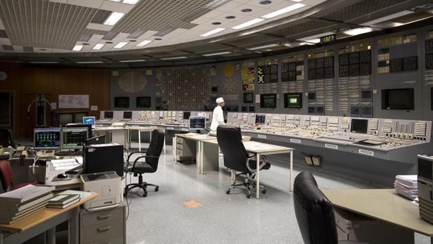 At Ignalina nuclear power plant, Mikhail Nefedyev was staring grimly at the row of blinking green lights on a control panel when another group of curious visitors poured into his realm. The 64 year-old engineer explained to them what exactly happened when a similar reactor exploded in Chernobyl, Ukraine, 33 years ago. (Mindaugas Kulbis / AP) 