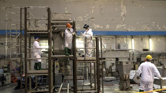 After locations in Vilnius, atomic tourists may opt to travel 160 kilometers (100 miles) north and join a three-hour tour of the nuclear plant. They are given dosimeters, plastic helmets, white clothes and shoes before venturing through a maze of long, poorly lit corridors, reactor halls, turbine hangars and the control center with the red button which was pushed just before the explosion. Cellphones, cameras, eating, drinking and smoking are strictly off limits. (Mindaugas Kulbis / AP) 