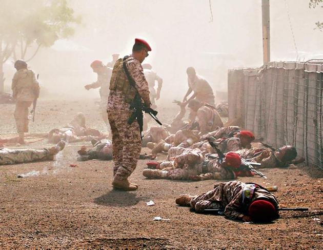 Soldiers lie on the ground after a missile attack on a military parade during a graduation ceremony for newly recruited troopers in Aden, Yemen(Reuters) Soldiers lie on the ground after a missile attack on a military parade during a graduation ceremony for newly recruited troopers in Aden, Yemen(Reuters)