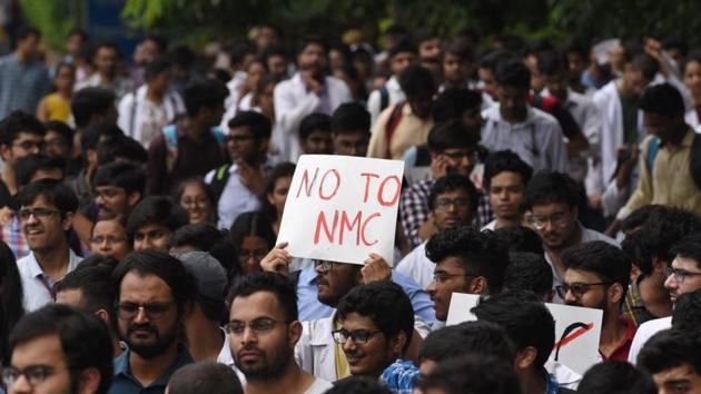 Resident doctors of LNJP Hospital march from the hospital to Rajghat against the National Medical Commission (NMC) bill. Government-run health facilities, including emergency services and in-patient surgeries, are likely to be severely disrupted in the national capital Thursday onwards after unions representing junior doctors said they will widen a protest against NMC, a new law meant to regulate the medical industry. (Sanchit Khanna / HT Photo) Resident doctors of LNJP Hospital march from the hospital to Rajghat against the National Medical Commission (NMC) bill. Government-run health facilities, including emergency services and in-patient surgeries, are likely to be severely disrupted in the national capital Thursday onwards after unions representing junior doctors said they will widen a protest against NMC, a new law meant to regulate the medical industry. (Sanchit Khanna / HT Photo)