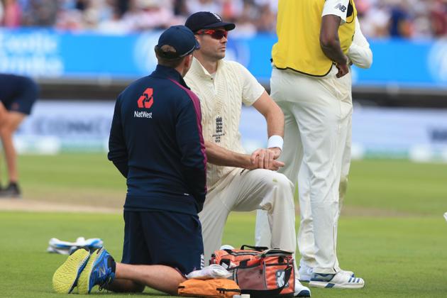 James Anderson receives attention during the first Ashes cricket Test match between England and Australia at Edgbaston.(AFP)