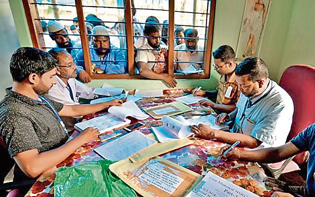 People wait to check their names on the draft list at the National Register of Citizens (NRC) centre at a village in Nagaon district, Assam state, India, July 30, 2018. REUTERS/Stringer/Files(REUTERS)