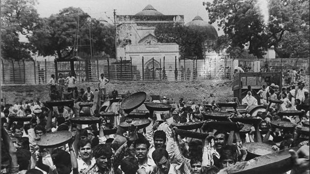 As BJP gained momentum with its Rath Yatra, thousands of kar sevaks gathered in Ayodhya. The mosque was partially damaged in 1990 and at least 30 were killed in police firing. The state government, under Mulayam Singh Yadav, swore protection and promised a complete lockdown of the site and city. (Rajiv Gupta / HT Archive) As BJP gained momentum with its Rath Yatra, thousands of kar sevaks gathered in Ayodhya. The mosque was partially damaged in 1990 and at least 30 were killed in police firing. The state government, under Mulayam Singh Yadav, swore protection and promised a complete lockdown of the site and city. (Rajiv Gupta / HT Archive)