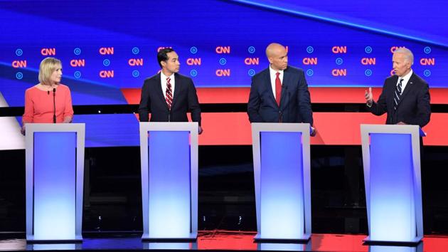 Moderate frontrunner Joe Biden and his 2020 Democratic rivals took the stage Wednesday ready for a dog fight but began their debate largely with cooler heads prevailing, uniting under a common goal of ousting President Donald Trump.(AFP Photo) Moderate frontrunner Joe Biden and his 2020 Democratic rivals took the stage Wednesday ready for a dog fight but began their debate largely with cooler heads prevailing, uniting under a common goal of ousting President Donald Trump.(AFP Photo)